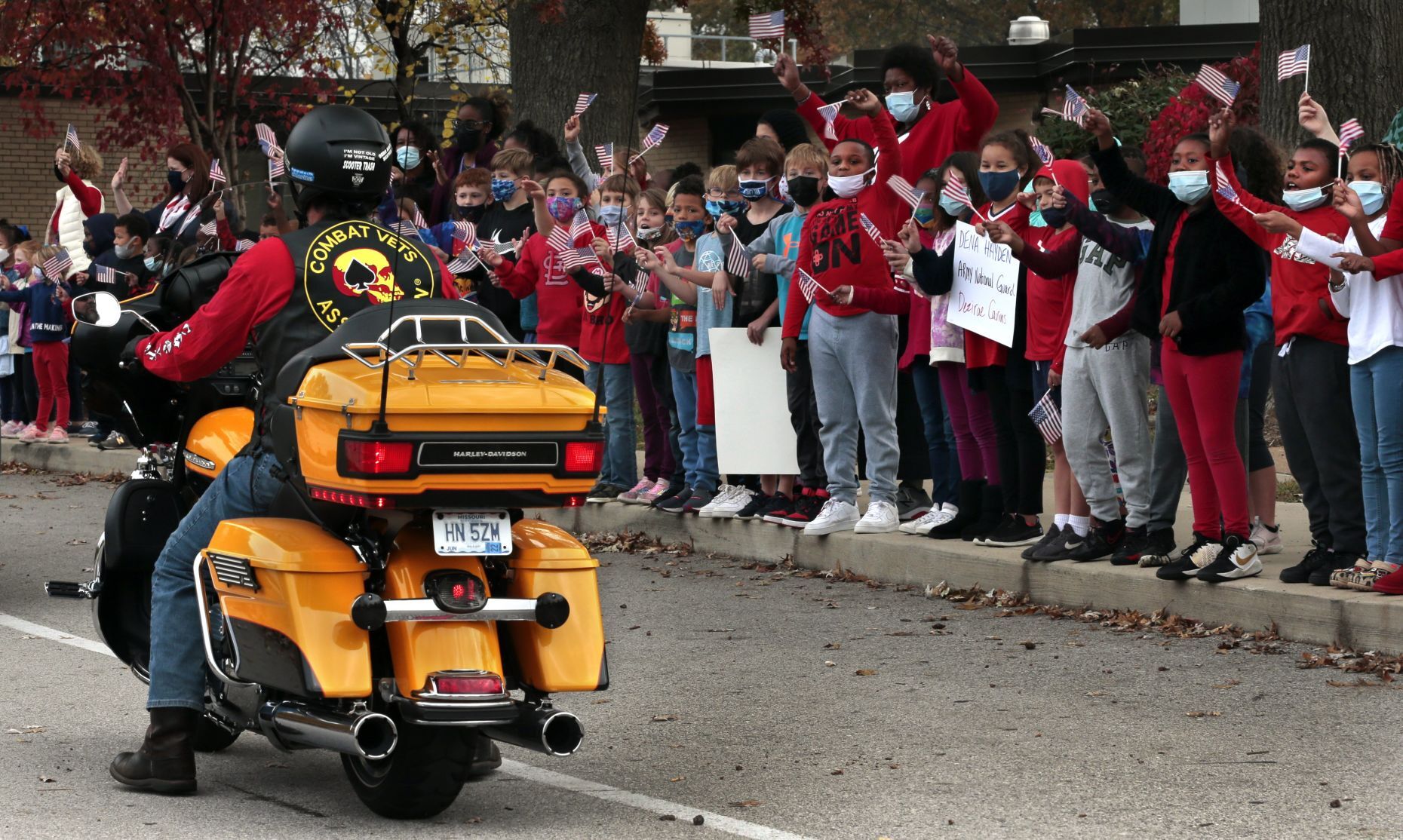 Students honor veterans with drive-by parade